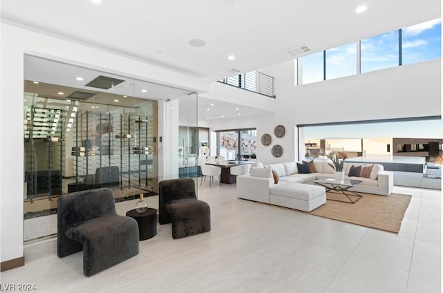 living room featuring plenty of natural light and light tile patterned floors