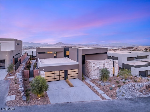 view of front facade featuring a mountain view and a garage