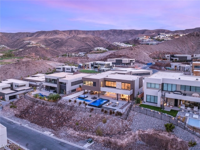 aerial view at dusk with a mountain view