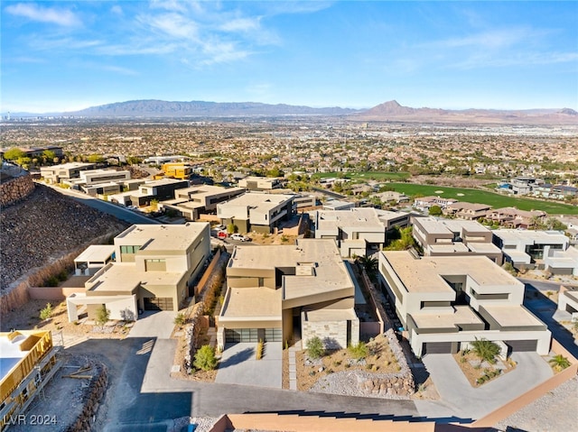 birds eye view of property featuring a mountain view