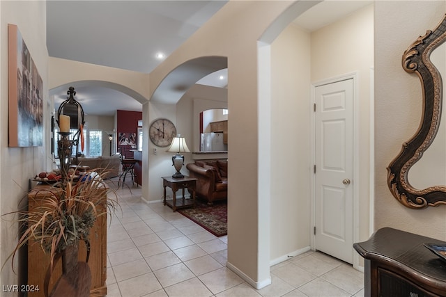 hallway with light tile patterned floors