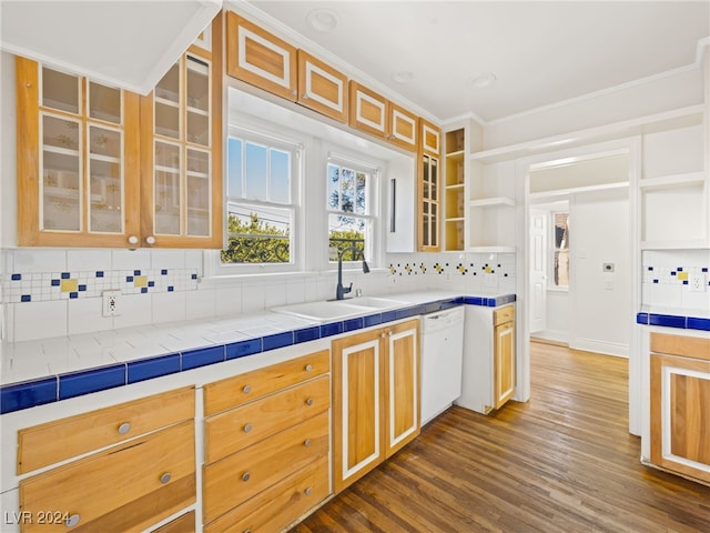 kitchen with tile counters, dark hardwood / wood-style flooring, backsplash, white dishwasher, and ornamental molding