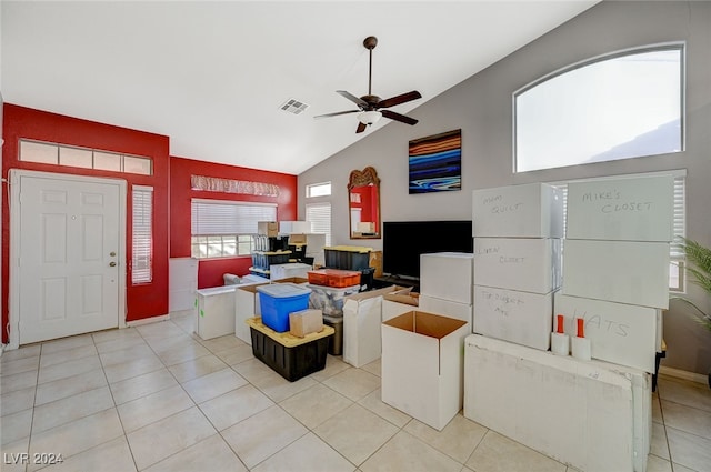 living room with ceiling fan, light tile patterned floors, and high vaulted ceiling