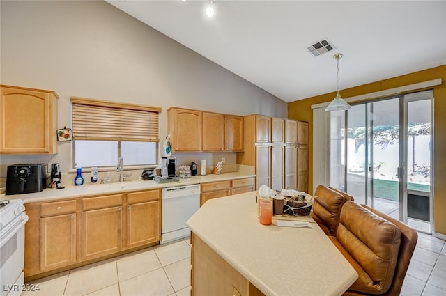 kitchen featuring pendant lighting, light brown cabinets, white appliances, sink, and vaulted ceiling