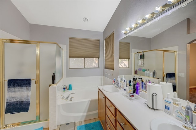 bathroom featuring tile patterned floors, vanity, independent shower and bath, and lofted ceiling