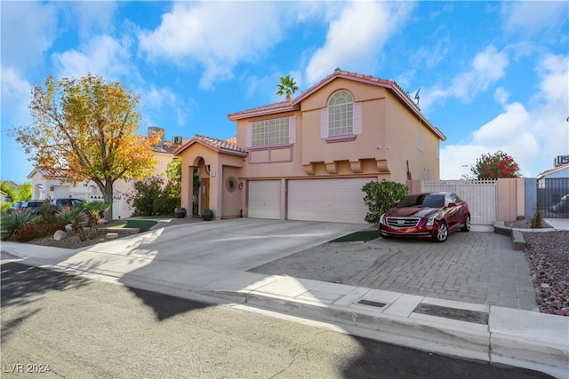 mediterranean / spanish-style home featuring a garage