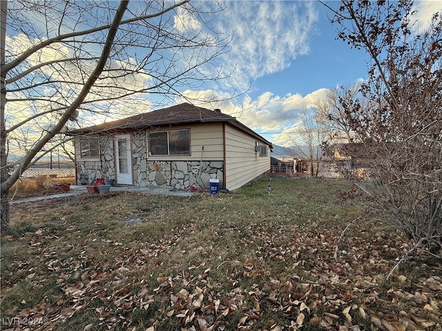 rear view of house with a lawn