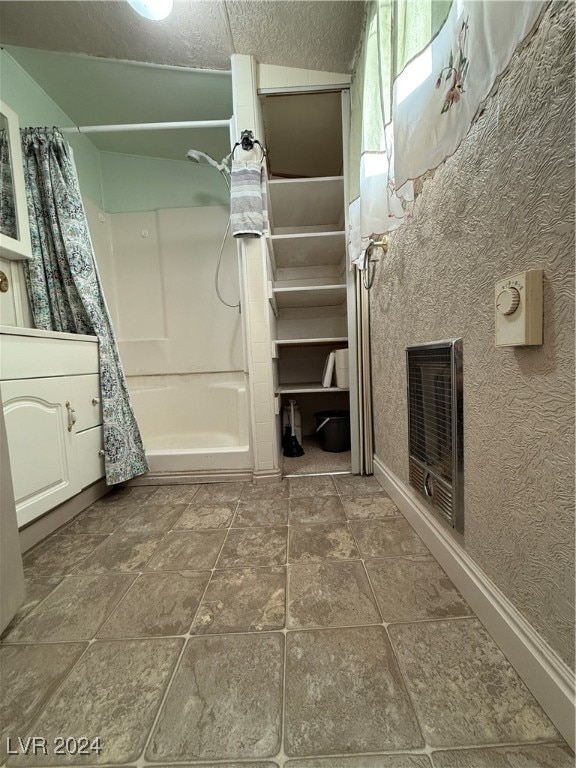 bathroom with curtained shower