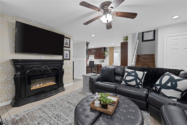 living room featuring ceiling fan and light tile patterned flooring