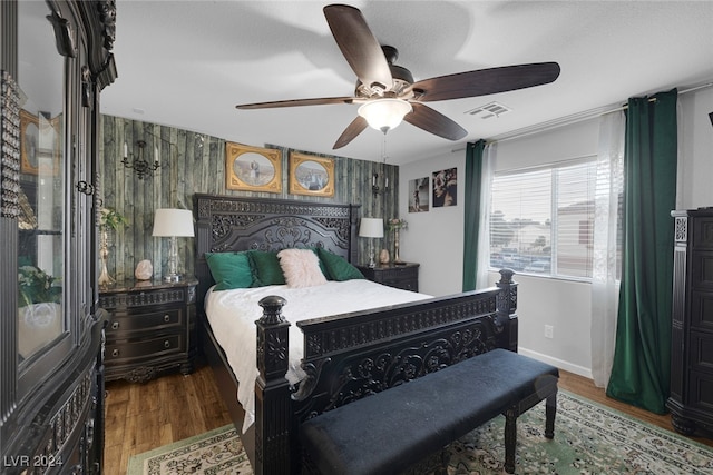 bedroom with hardwood / wood-style floors and ceiling fan