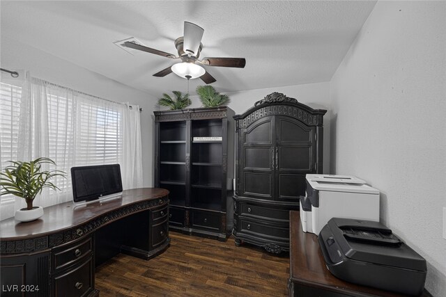 home office with dark hardwood / wood-style floors, ceiling fan, lofted ceiling, and a textured ceiling