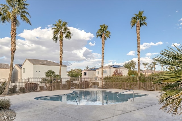 view of swimming pool featuring a patio area