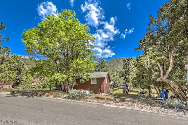 view of front of home featuring a mountain view