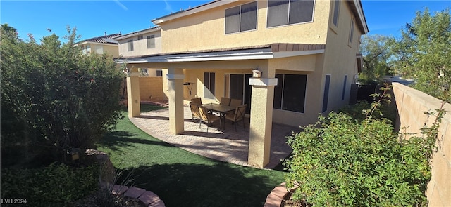 rear view of property with a patio area