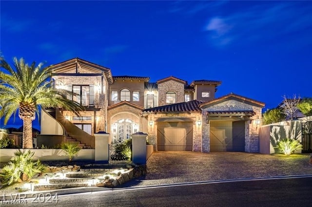 mediterranean / spanish-style house featuring a garage