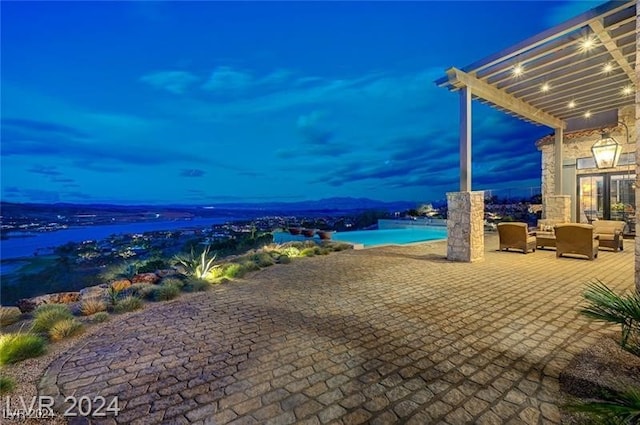 patio terrace at dusk with outdoor lounge area, a water view, and a pergola