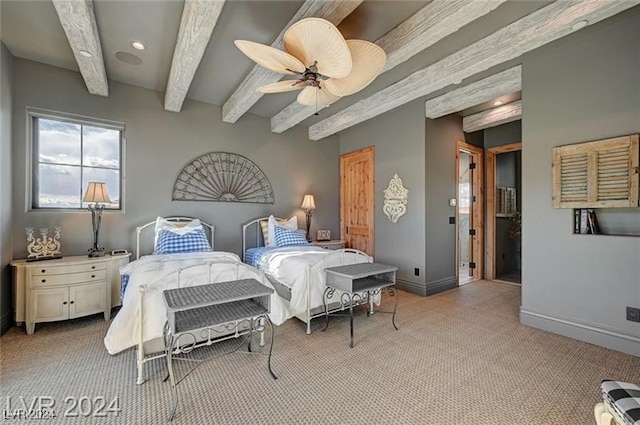 carpeted bedroom with beam ceiling and ceiling fan