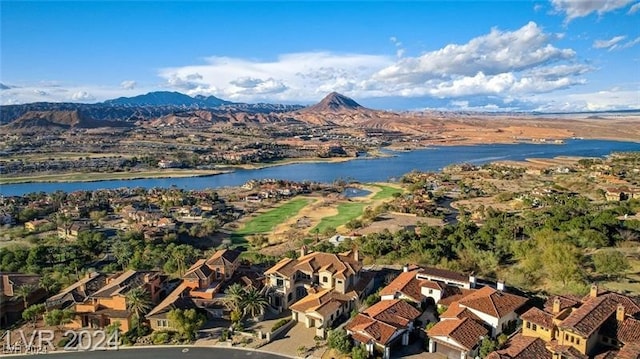 bird's eye view with a water and mountain view