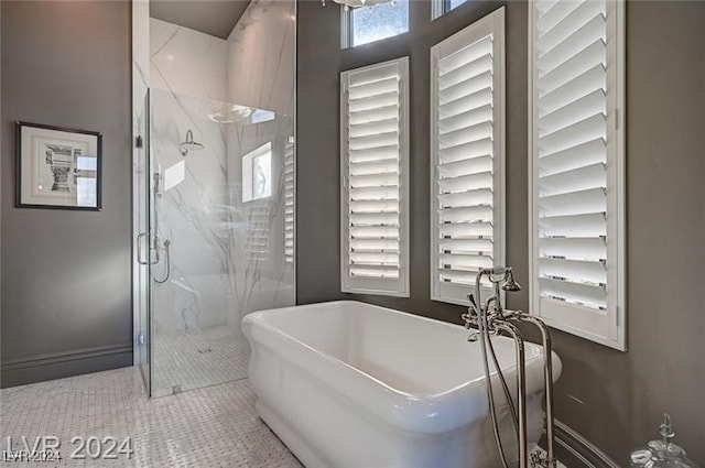 bathroom with tile patterned floors and plus walk in shower