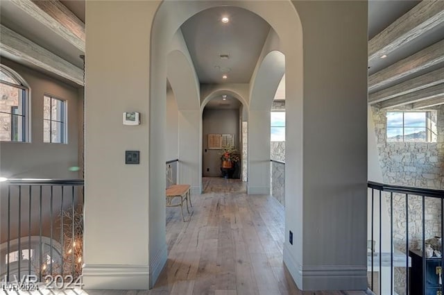 corridor featuring hardwood / wood-style floors