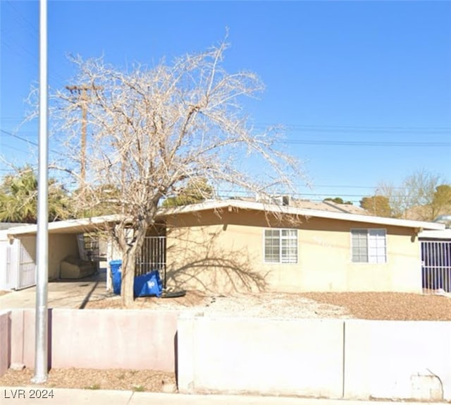 ranch-style home with a carport