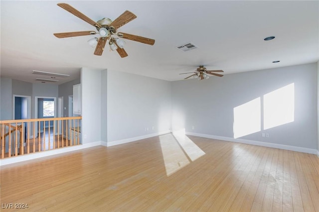 unfurnished room with ceiling fan and light hardwood / wood-style floors