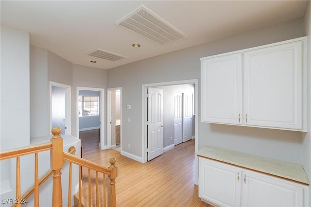 hall with light hardwood / wood-style floors