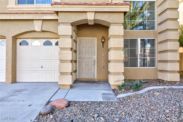 entrance to property featuring a garage