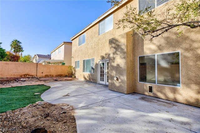 rear view of house featuring a patio