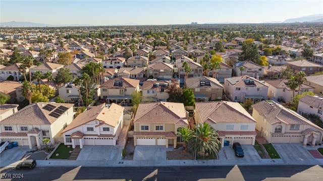 birds eye view of property featuring a mountain view