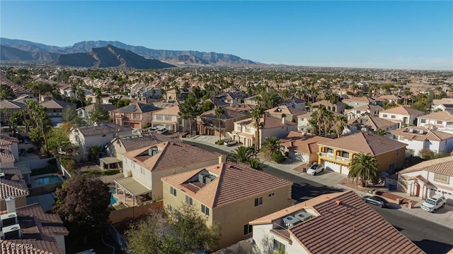 birds eye view of property featuring a mountain view