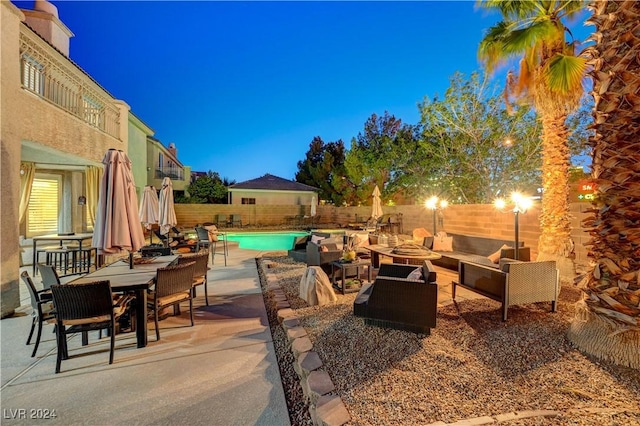 view of patio with a fenced in pool and an outdoor living space