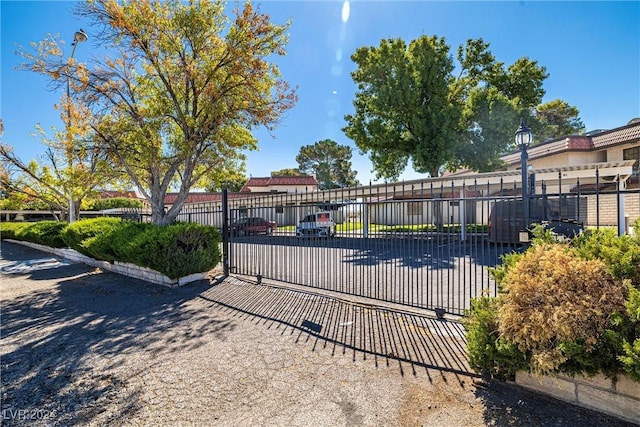 view of gate featuring fence