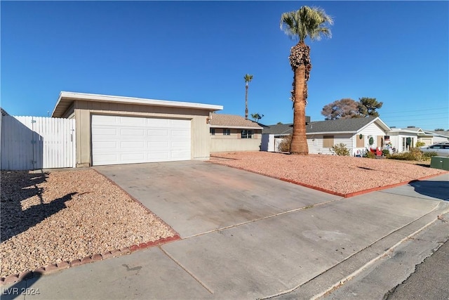 ranch-style house featuring a garage