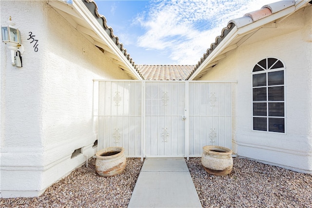 exterior space featuring crawl space, fence, and stucco siding