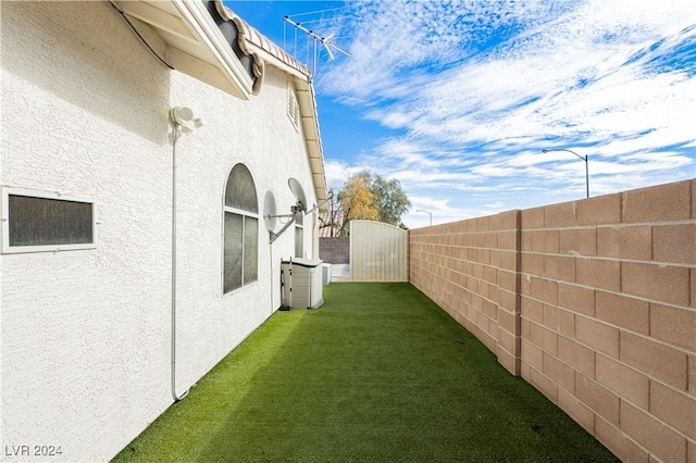 view of yard featuring a gate and fence