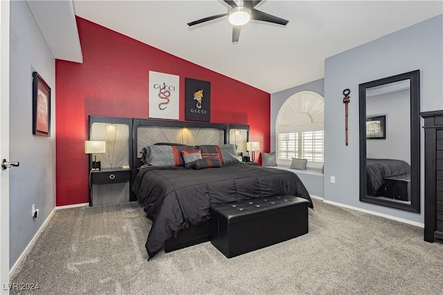 bedroom featuring an accent wall, vaulted ceiling, carpet floors, and baseboards