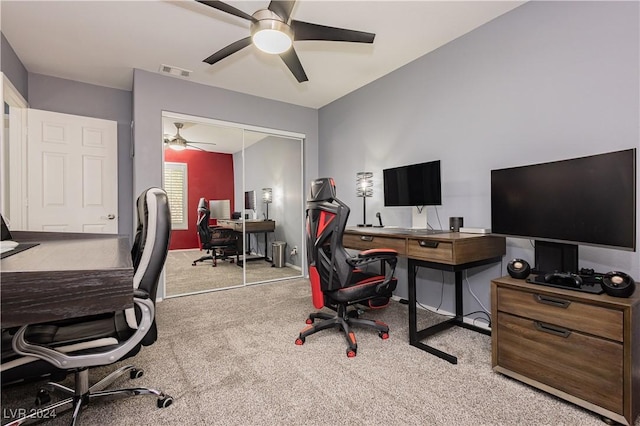 office area with carpet, visible vents, and a ceiling fan