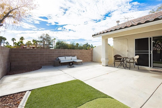 view of patio / terrace with a fenced backyard and an outdoor living space