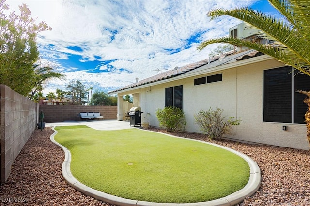 view of yard featuring a patio and a fenced backyard