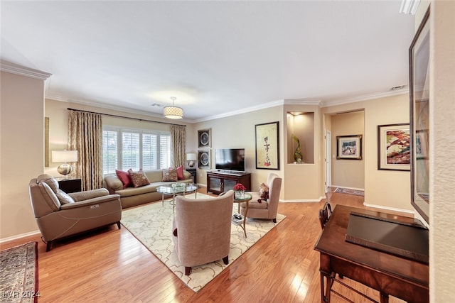 living room featuring crown molding and light wood-type flooring