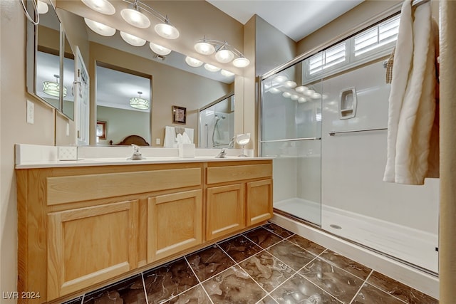 bathroom featuring vanity and a shower with shower door