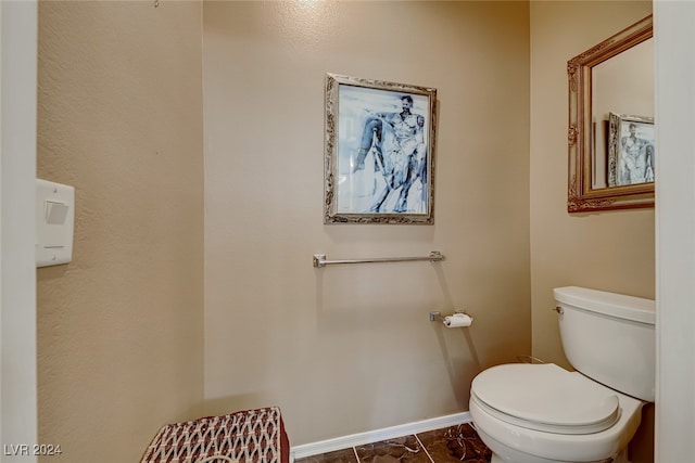 bathroom featuring tile patterned flooring and toilet