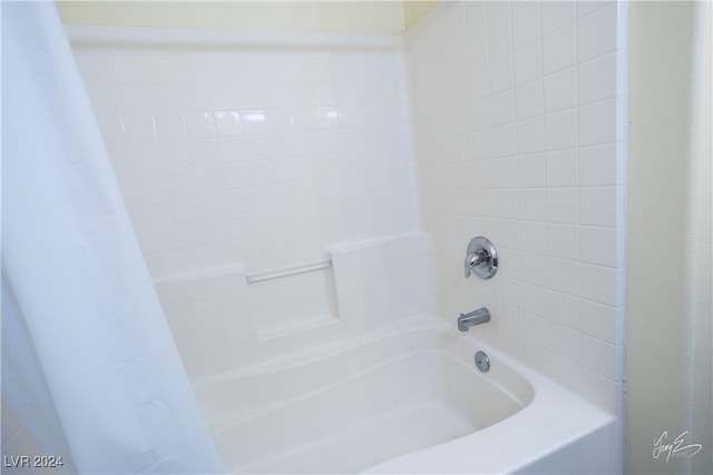 bathroom featuring shower / bath combination with curtain