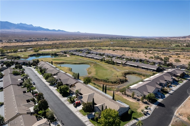 birds eye view of property featuring a water and mountain view