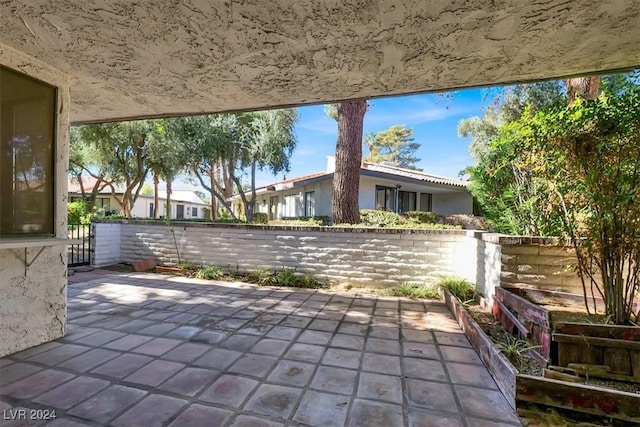 view of patio featuring fence