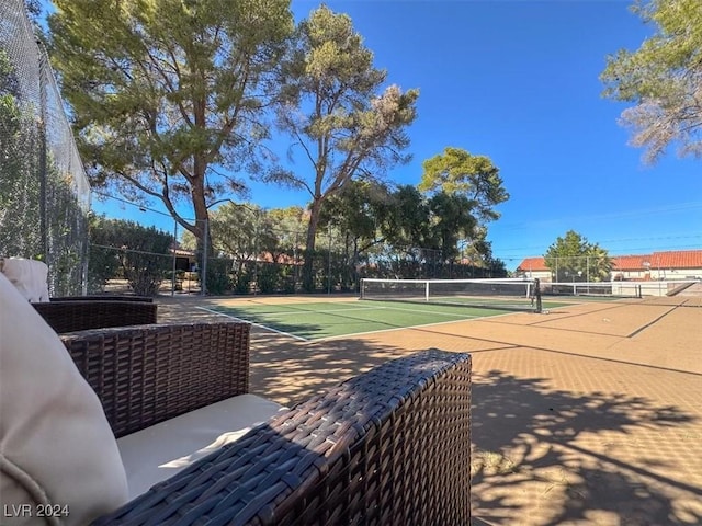 view of sport court with community basketball court and fence