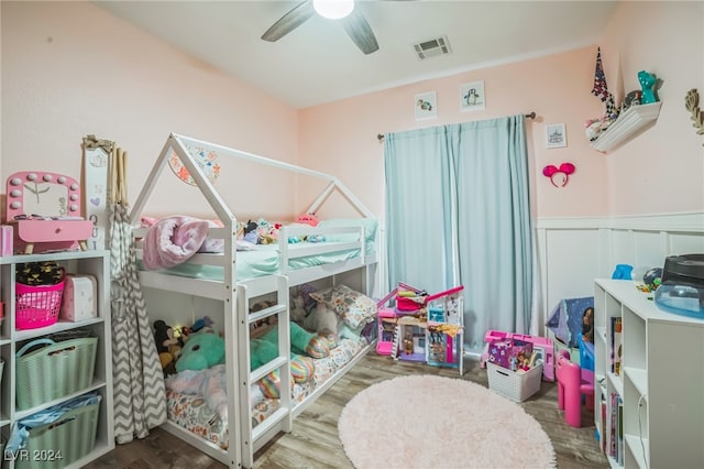 bedroom with ceiling fan and hardwood / wood-style floors