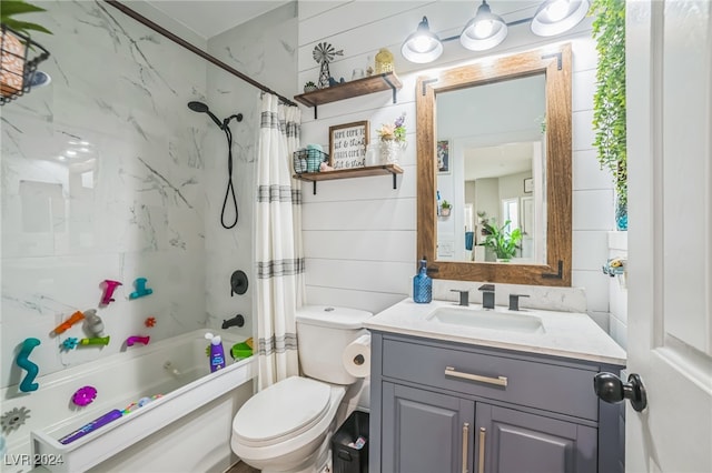 full bathroom with vanity, toilet, and shower / bath combo with shower curtain