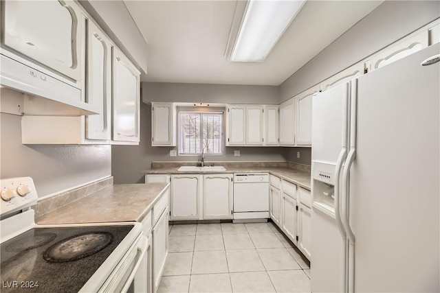 kitchen featuring white cabinetry, sink, light tile patterned flooring, and white appliances